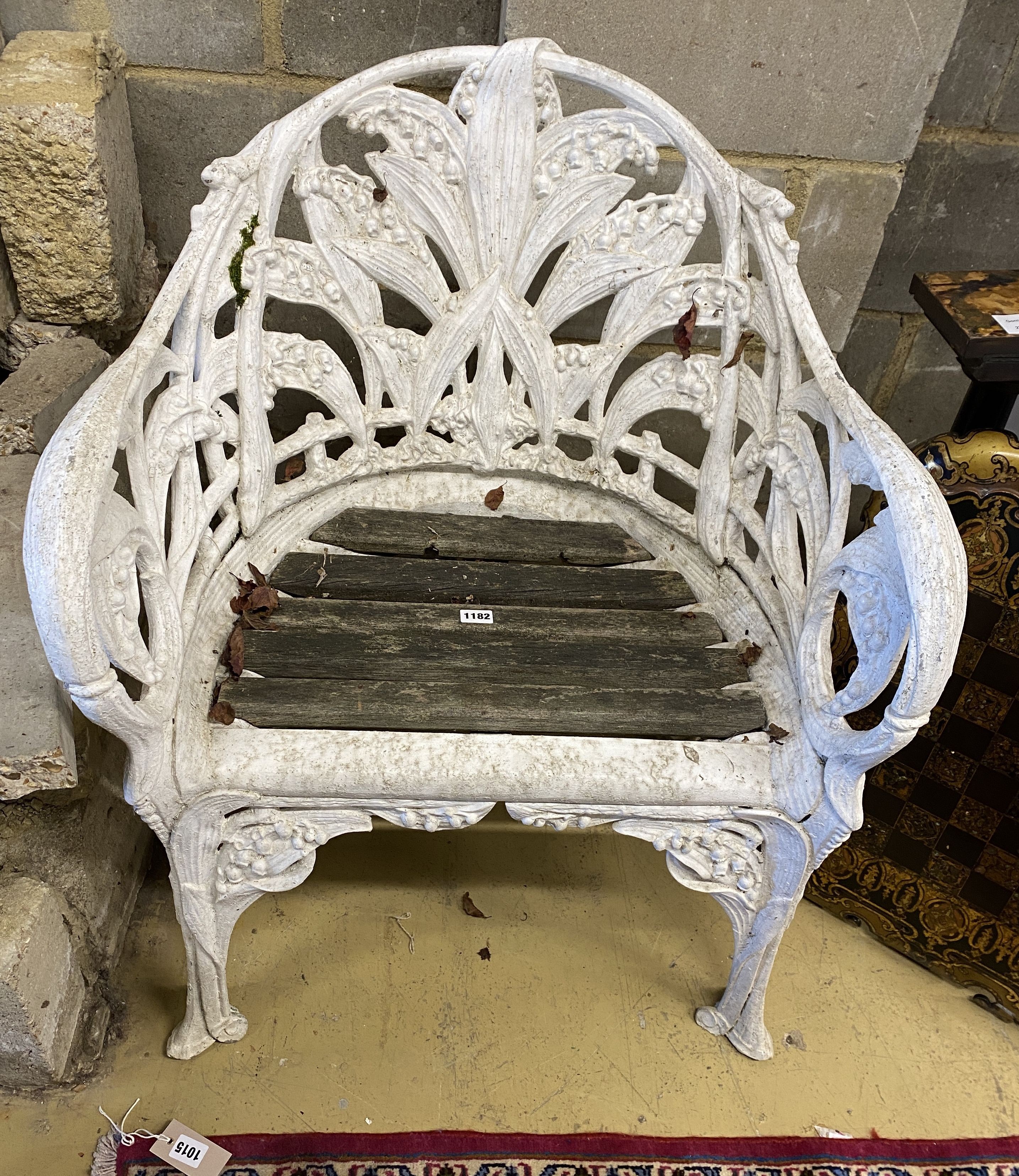 A Coalbrookdale style cast aluminium garden chair with slatted wood seat, width 65cm, depth 52cm, height 80cm